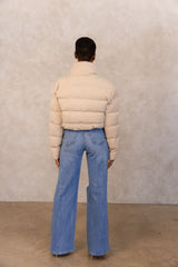 Our organic cotton down cropped puffer with elastic bungee strap, serves high quality streetwear. The elastic bungee straps are trimmed with gold hardware. This jacket checks out more than just styling. Stay warm this cozy season, in this weatherproof, and ELILE approved look.